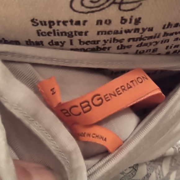 Women's BCBGenerations blue print knit jersey dress with cute back ties. Size M - Picture 4 of 4